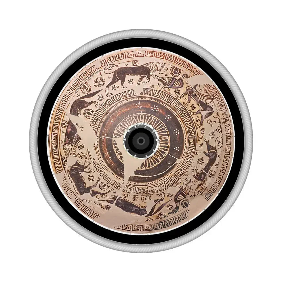 Wheelchair spoke guard with wild goat and Greek pottery pattern design on wheel.