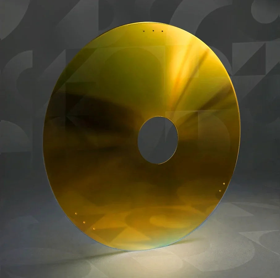 Yellow wheelchair spoke guard with central hub hole on a neutral background